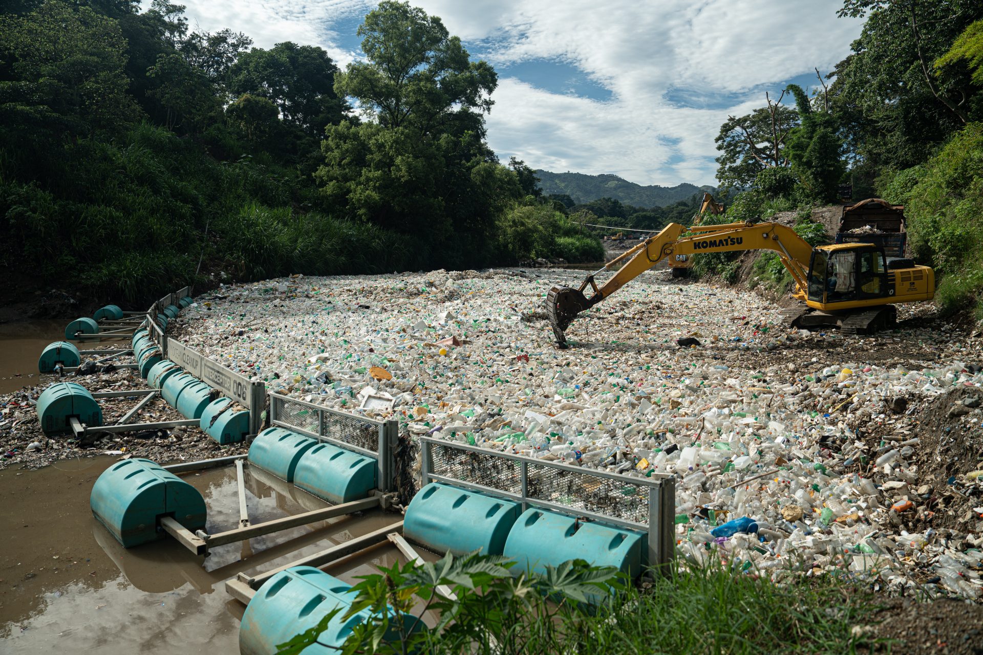 Excavators removing trash accumulated at Interceptor 006 in Rio Las Vacas, Guatemala